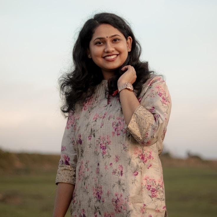 Mira Kapoor, Client Relations Director, discussing corporate gifting strategy with business clients